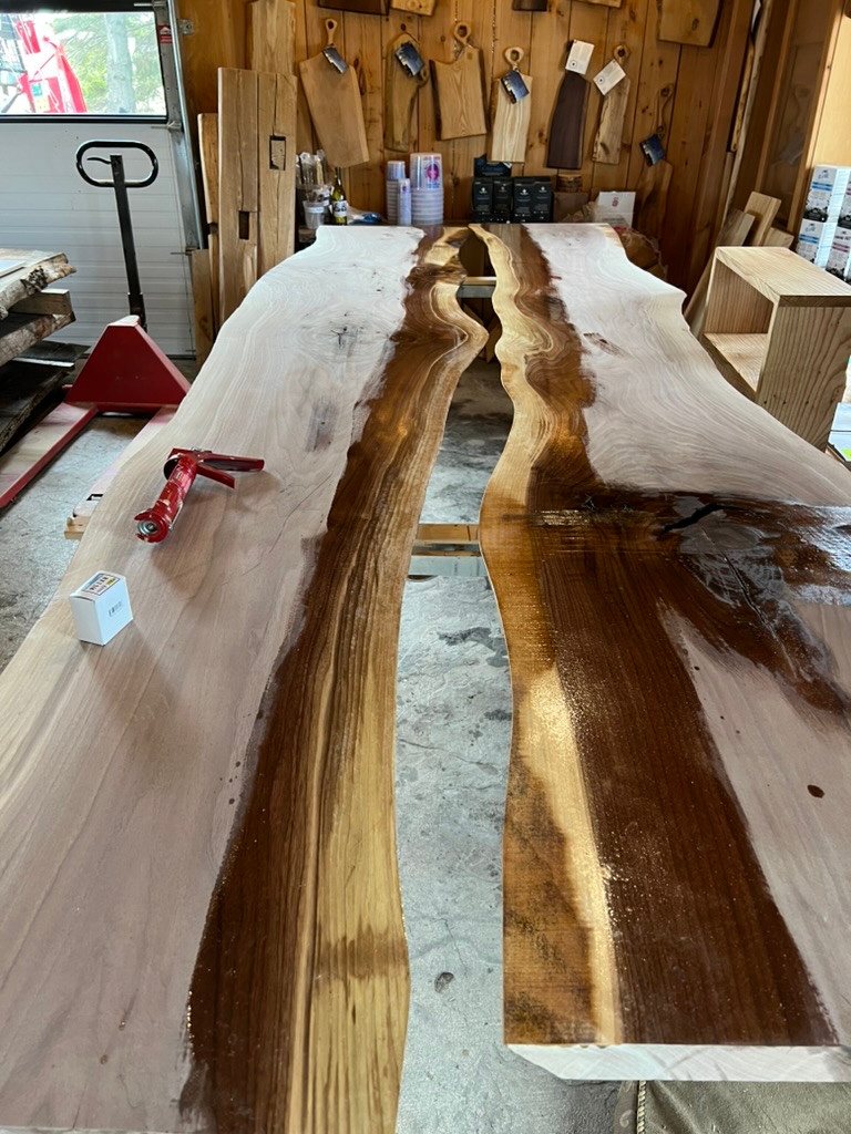 Conference-table slabs laid out before the centre is filled