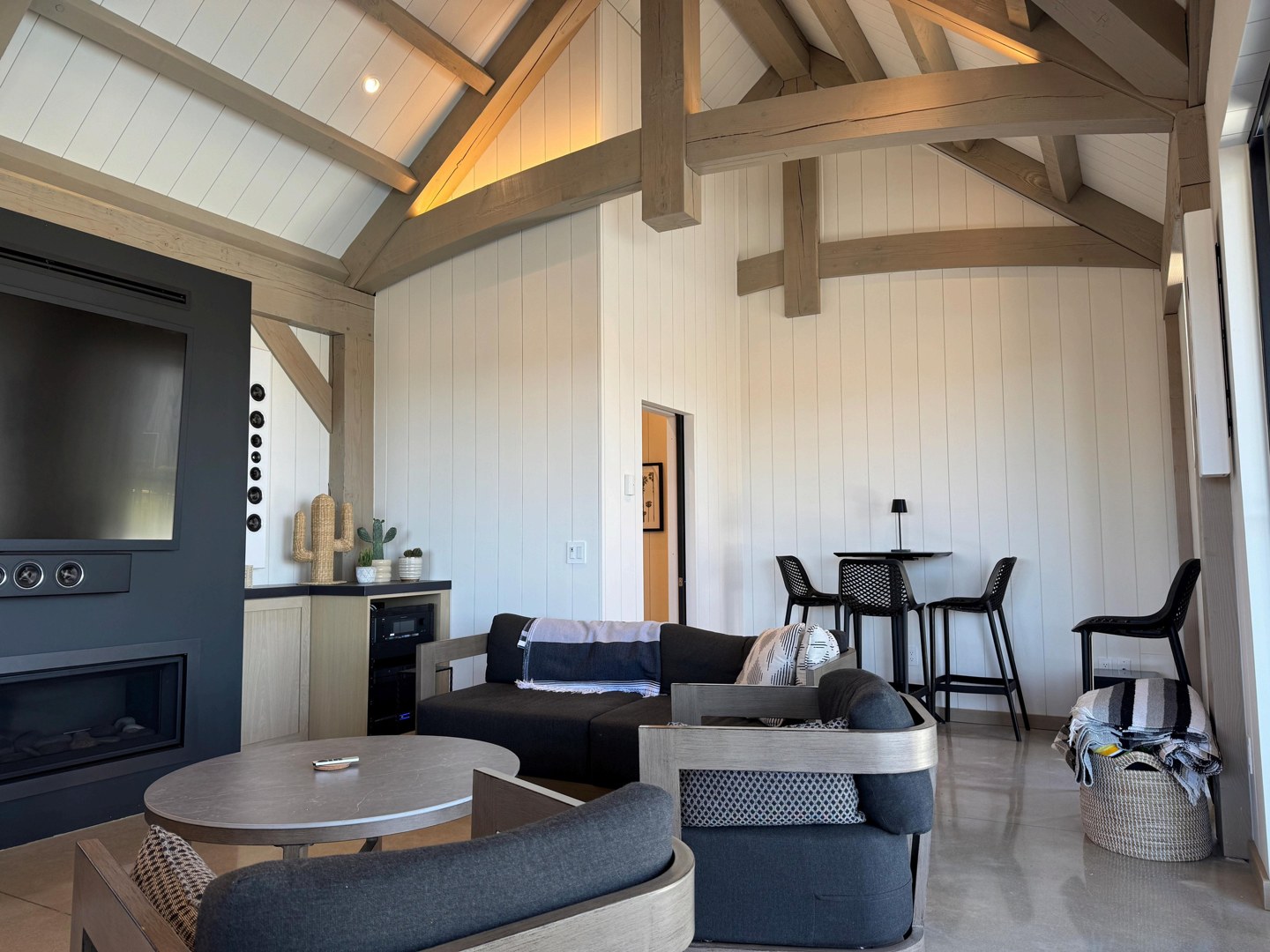 Finished pool-house room with timber framing and glazed openings
